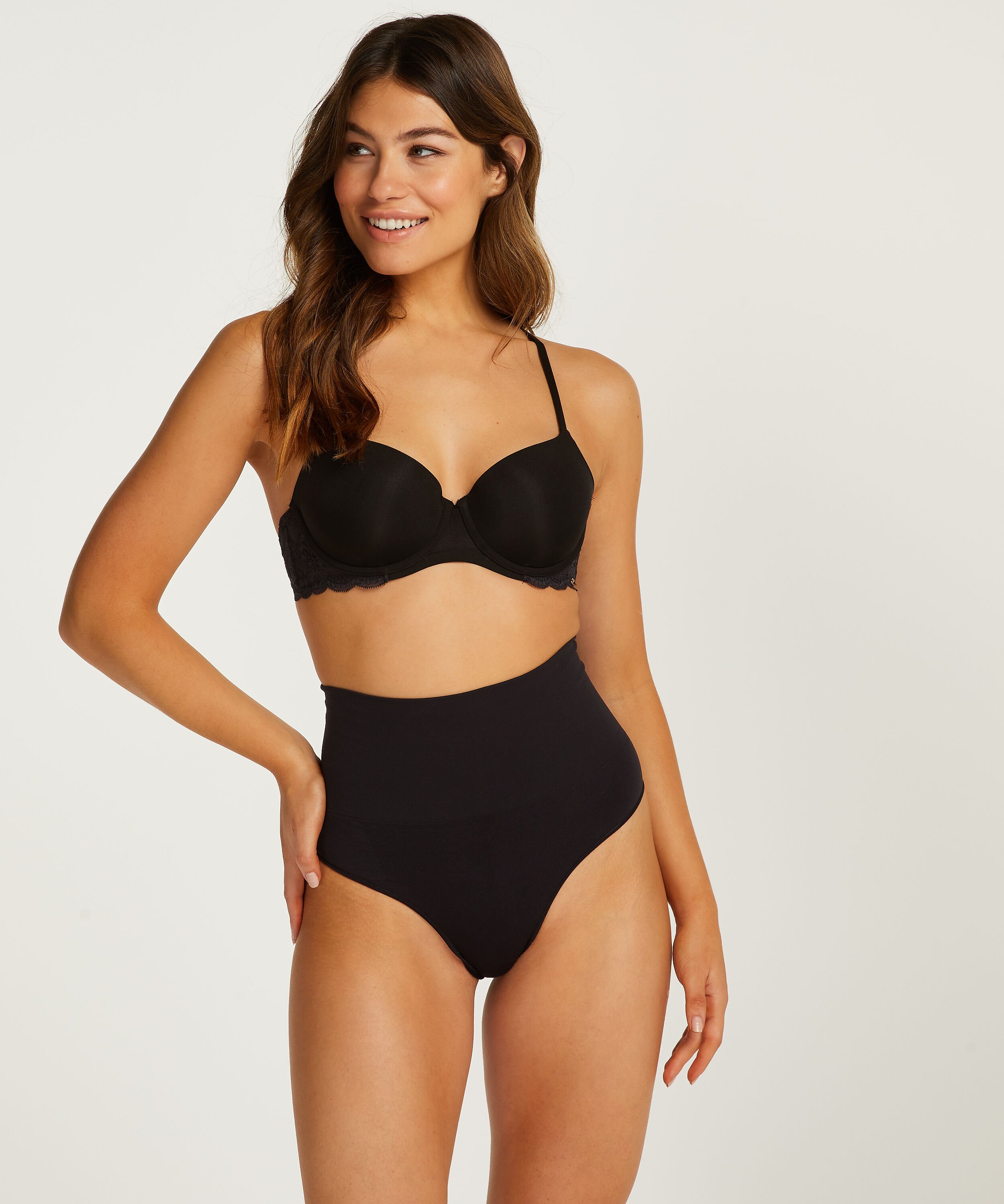 Hoher, straffendes String, seamless, Schwarz Hoher, straffendes String, seamless, Schwarz