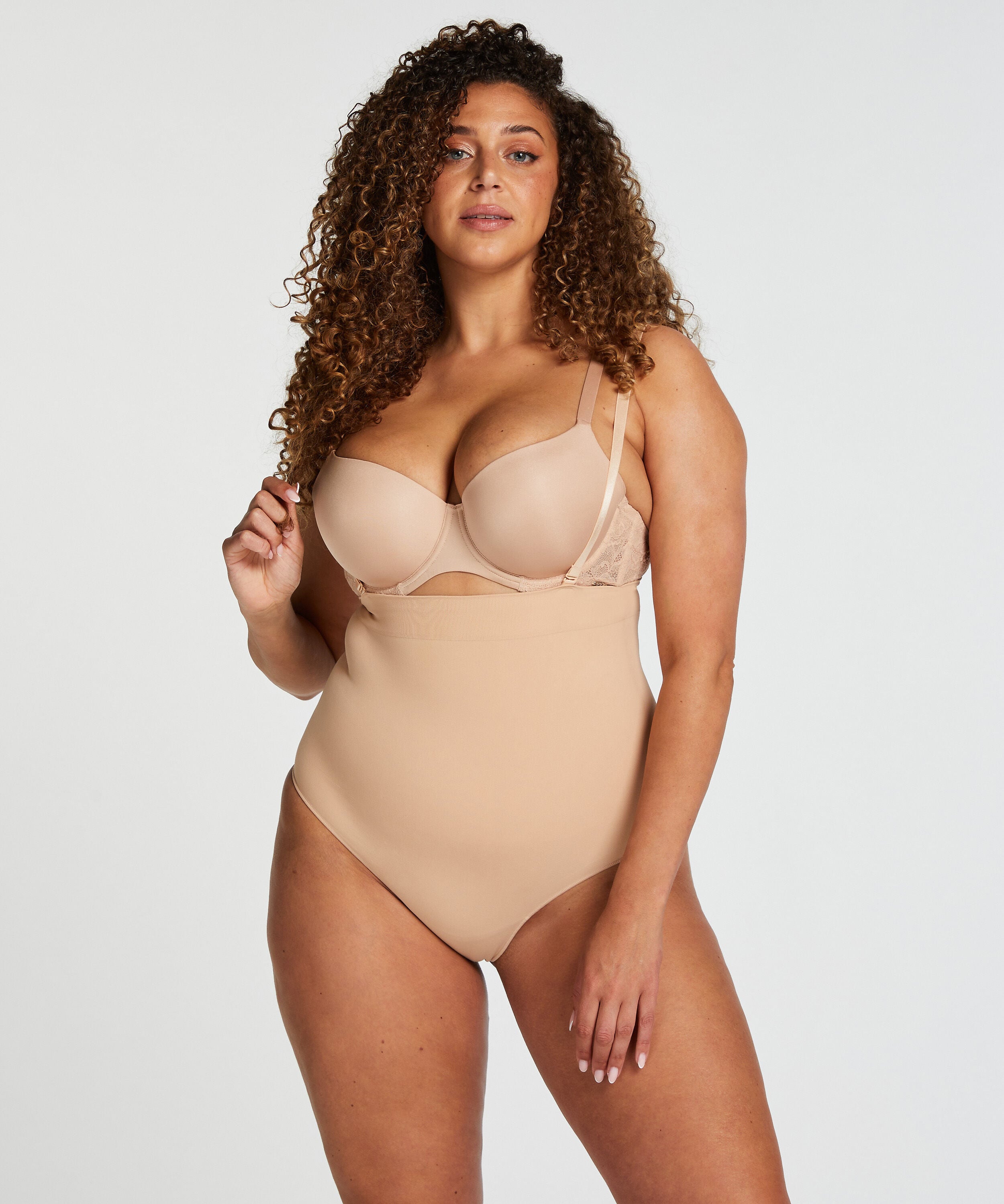 Nahtloser betonender korrigierender String mit hoher Taille